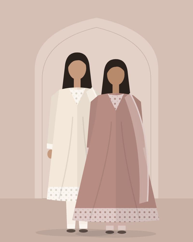 Models in ivory and blush festive suits under an arch