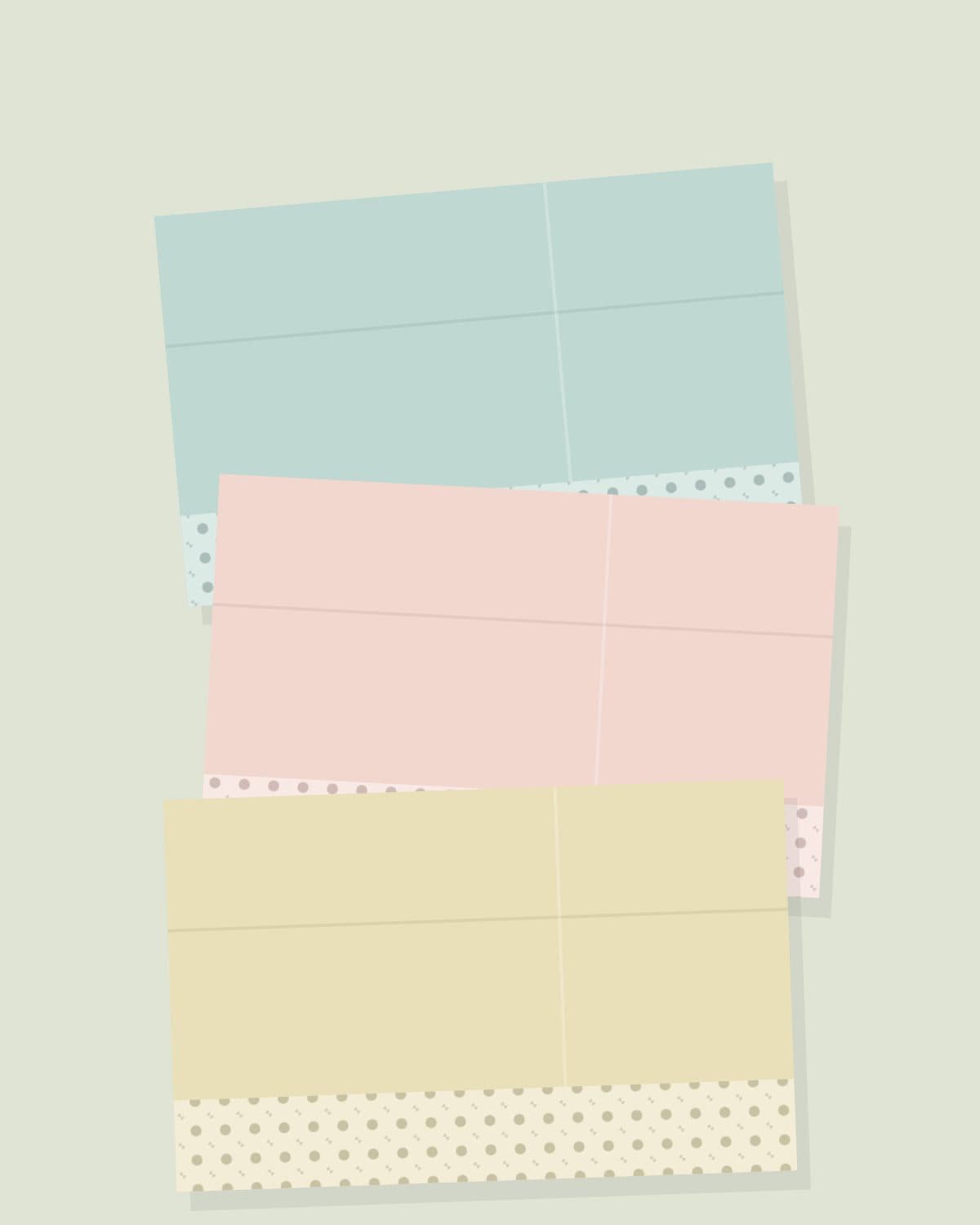 Folded lengths of aqua, blush and butter yellow printed lawn laid flat on a sage surface